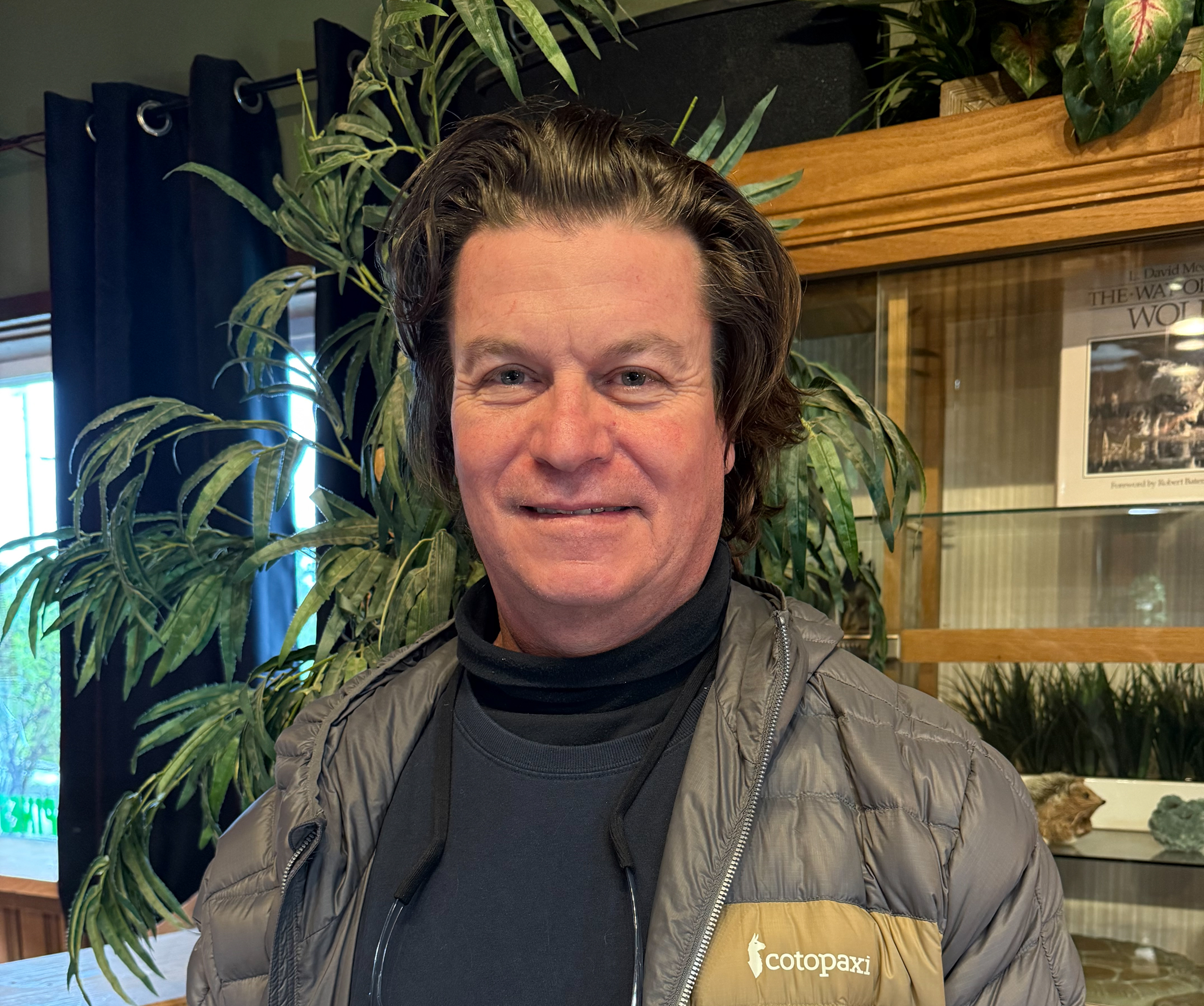 Beck Straussner sitting with a marine mammal