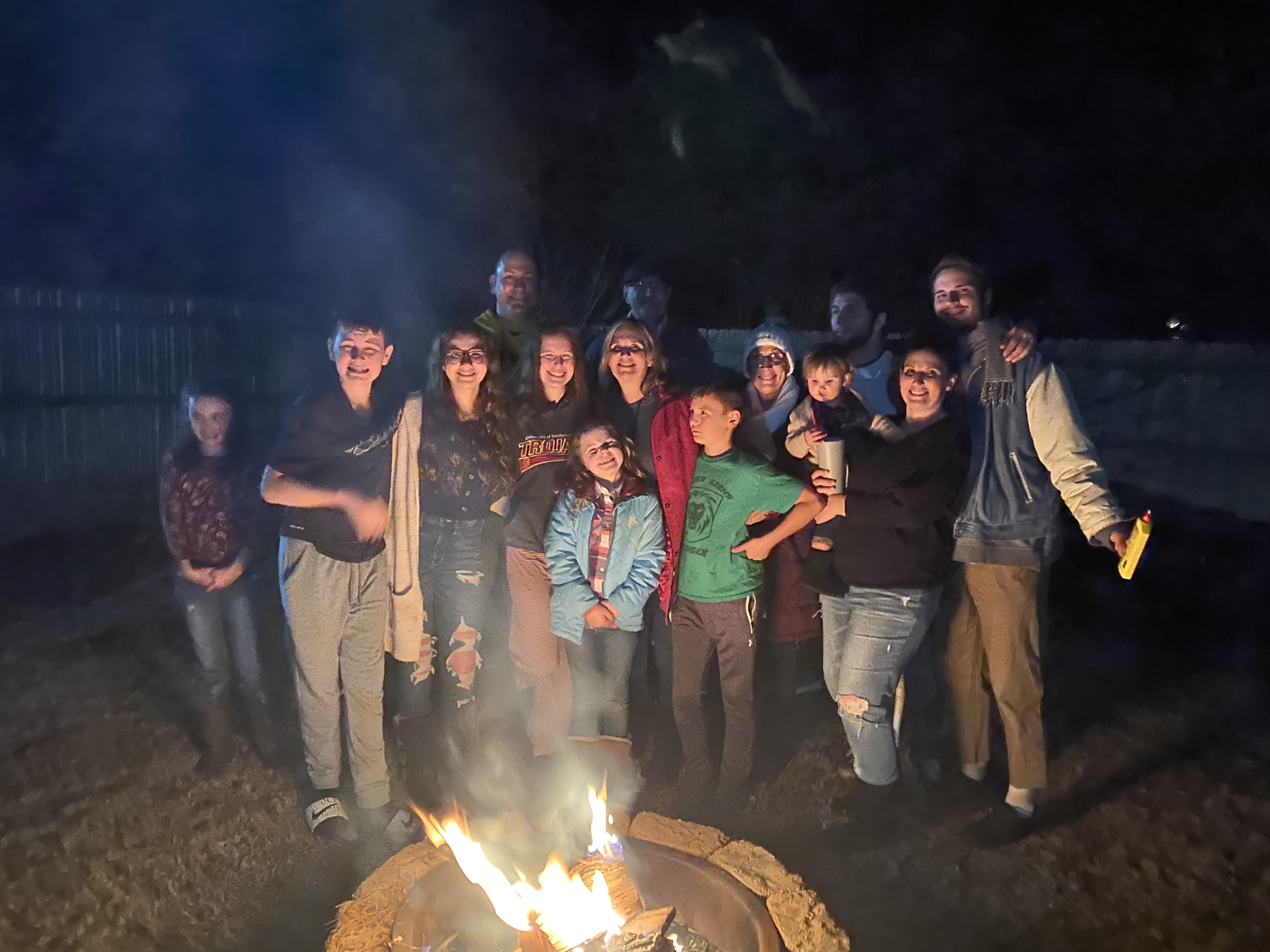 Volunteers around a campfire